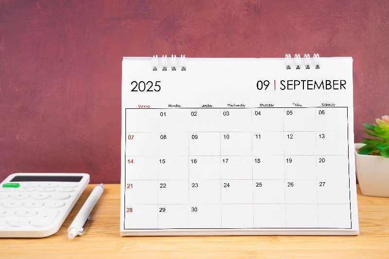 September 2025 white calendar and calculator
