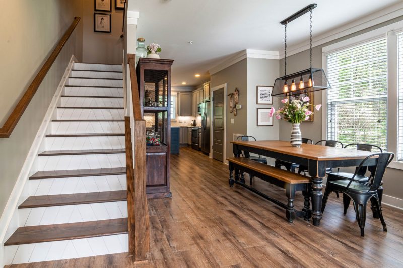 Home 9 Bright and inviting dining area features a wooden table stai 1784048529
